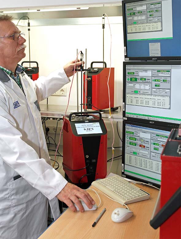 Sika lab technician using calibration equipment for testing